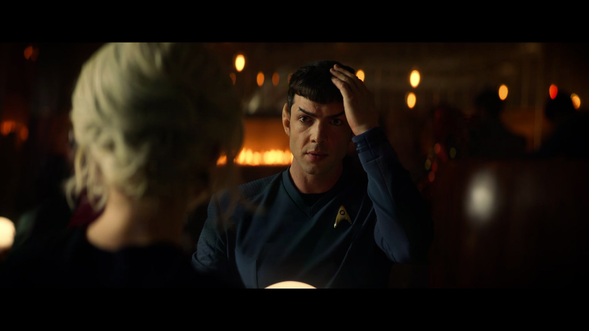 From Strange New Worlds, Spock sitting in front of Chapel touching his head. 
