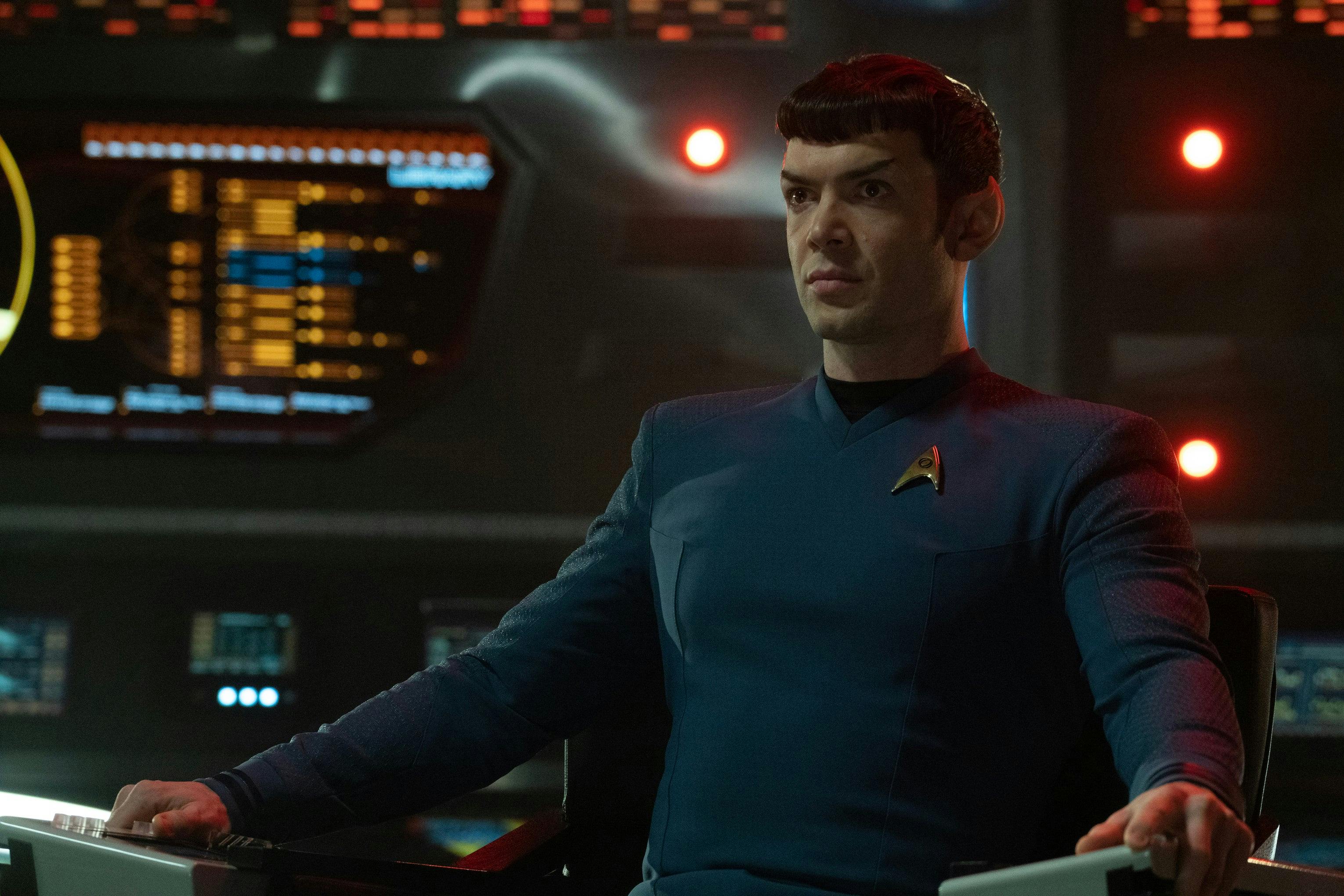 Spock sits in the captain's chair on the bridge