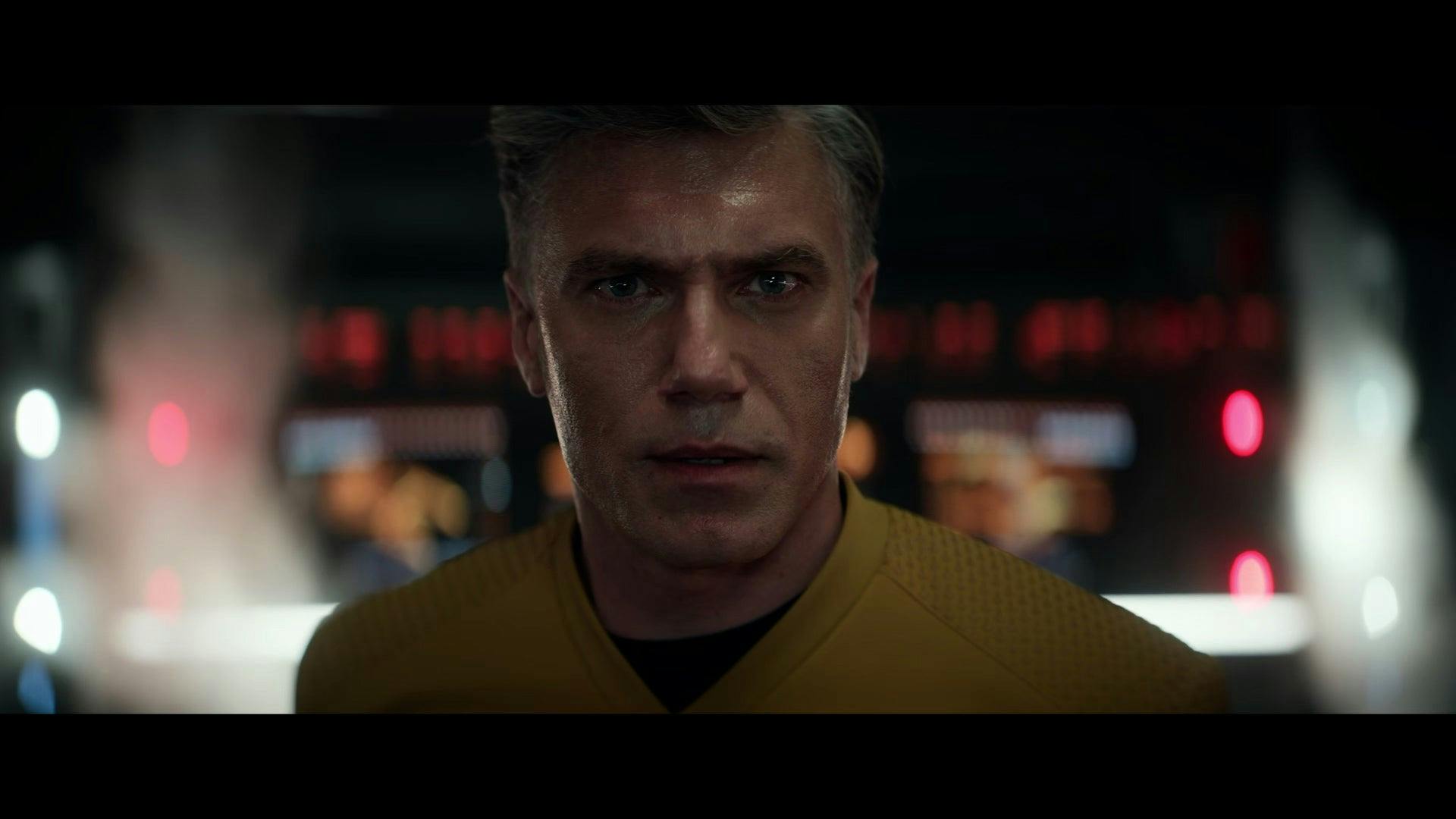 Captain Pike with a distressed look on his face.