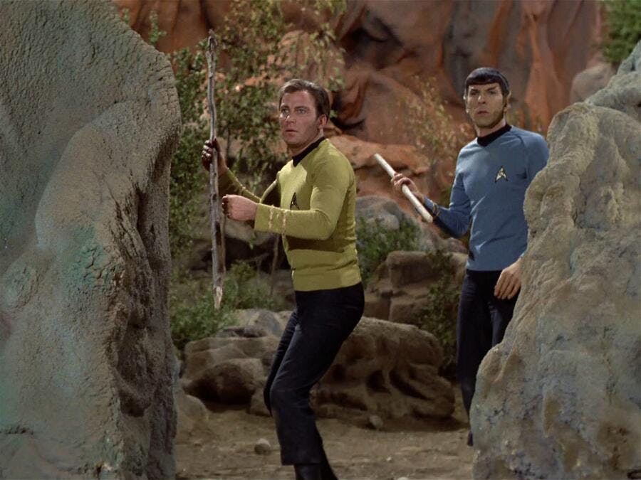Kirk holds a spear with Spock beside him in 'The Savage Curtain'