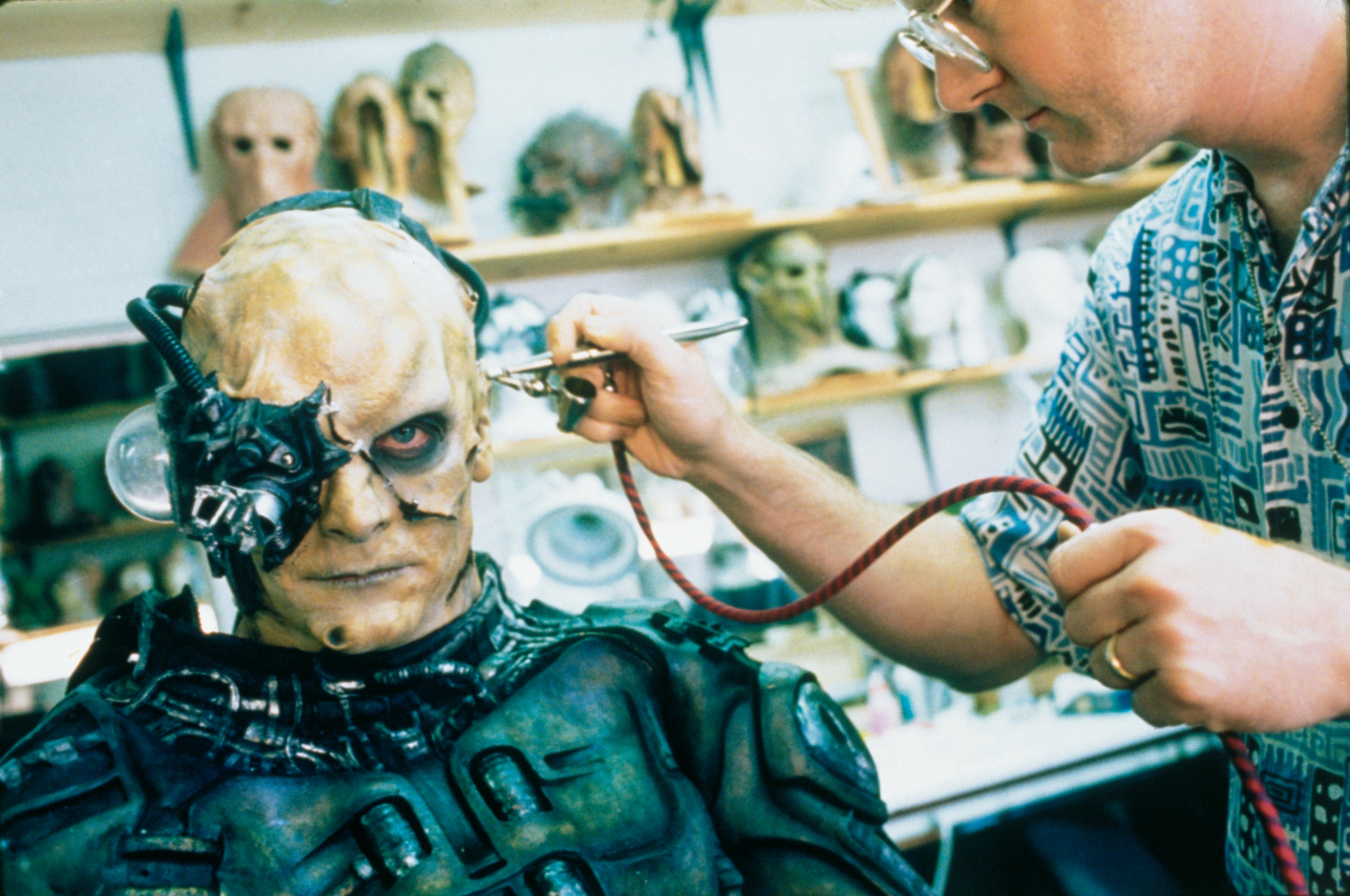 Make-up artist putting finishing touches on Borg prosthetics for Star Trek: First Contact