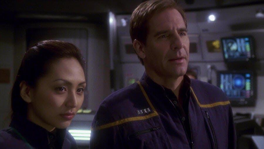 Hoshi Sato and Jonathan Archer stand on the bridge of the NX-01.