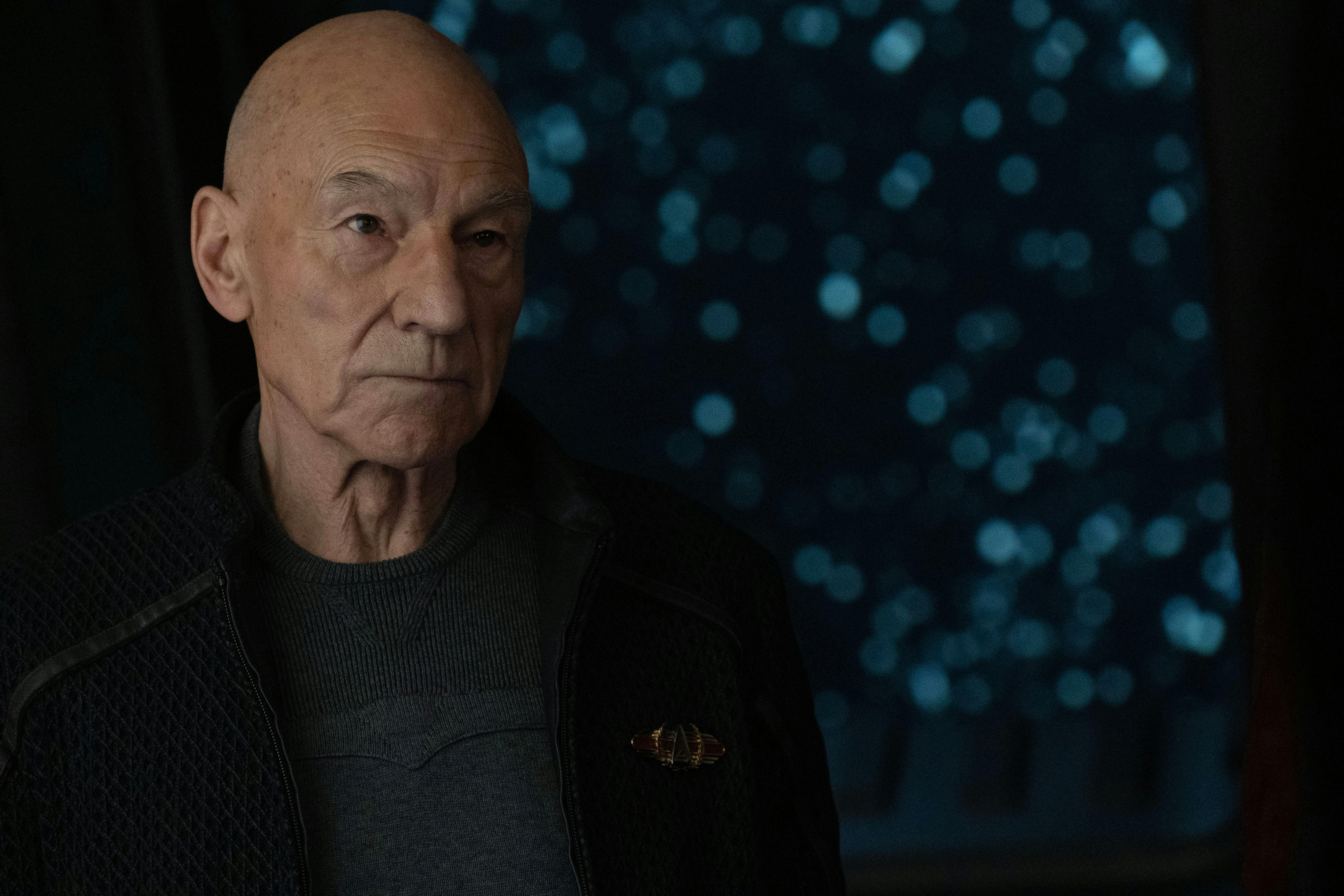 A close-up of Picard who looks ahead