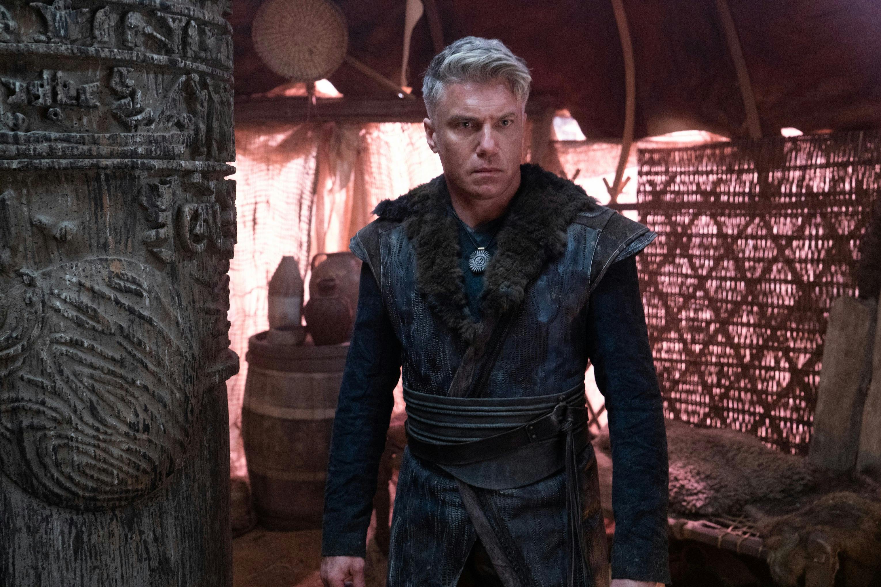 Christopher Pike dressed in a civilian attire against a carved pillar in 'Among the Lotus Eaters'
