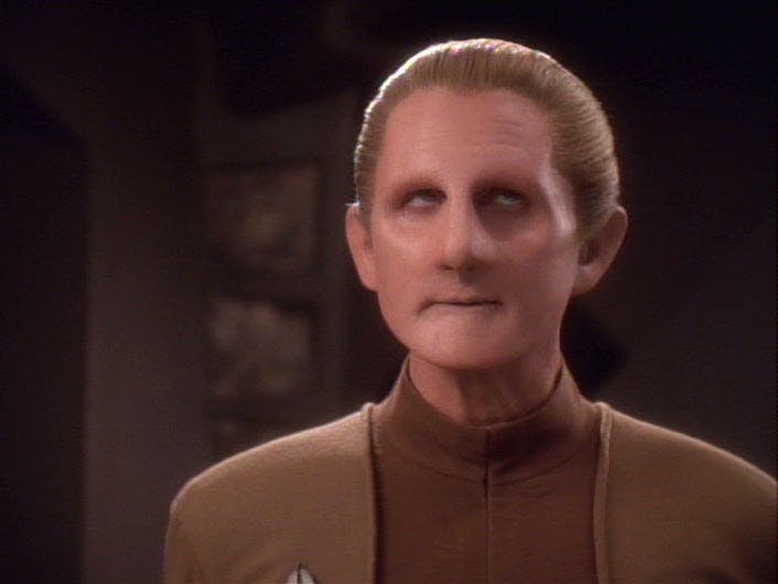 Listening to Quark, Odo rolls his eyes on Star Trek: Deep Space Nine