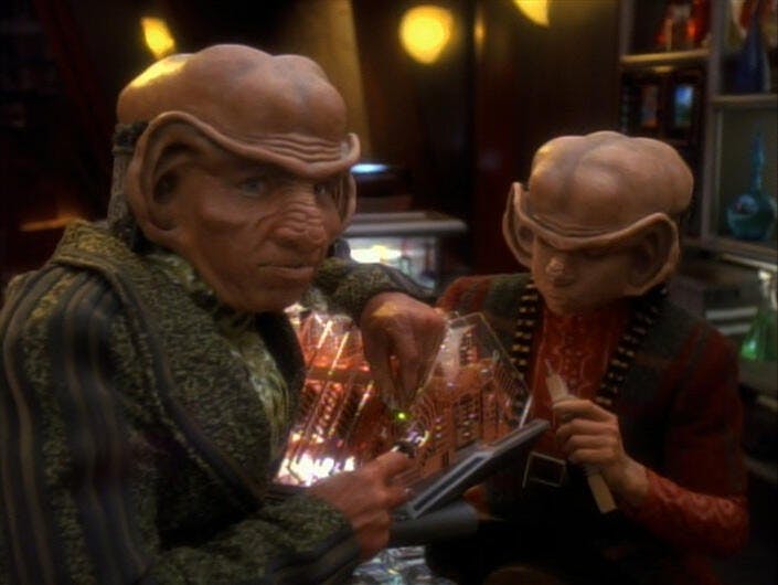 Nog and Rom tinker with equipment at Quark's Bar in 'Heart of Stone'
