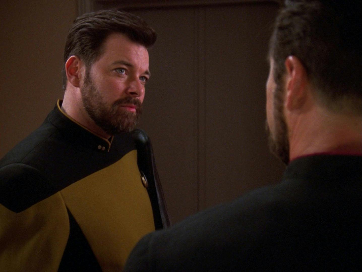 Thomas Riker with his bag over his shoulder looks over at Will in 'Second Chances'