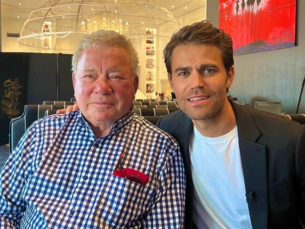 William Shatner and Paul Wesley pose for a photo.