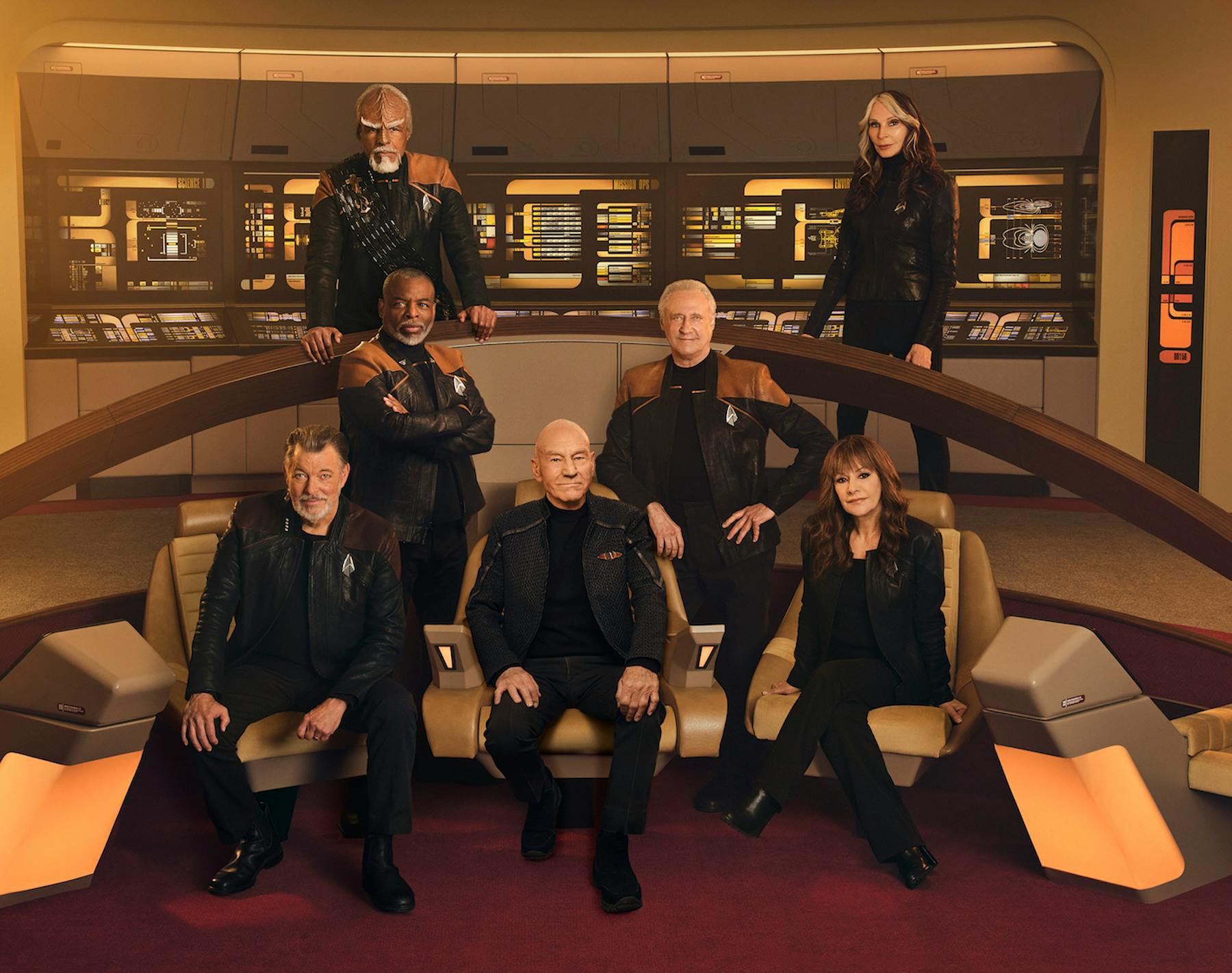The TNG crew on the bridge of the reconstructed Enterprise-D (Worf, Beverly Crusher, Geordi La Forge, Data, Will Riker, Jean-Luc Picard, and Deanna Troi)