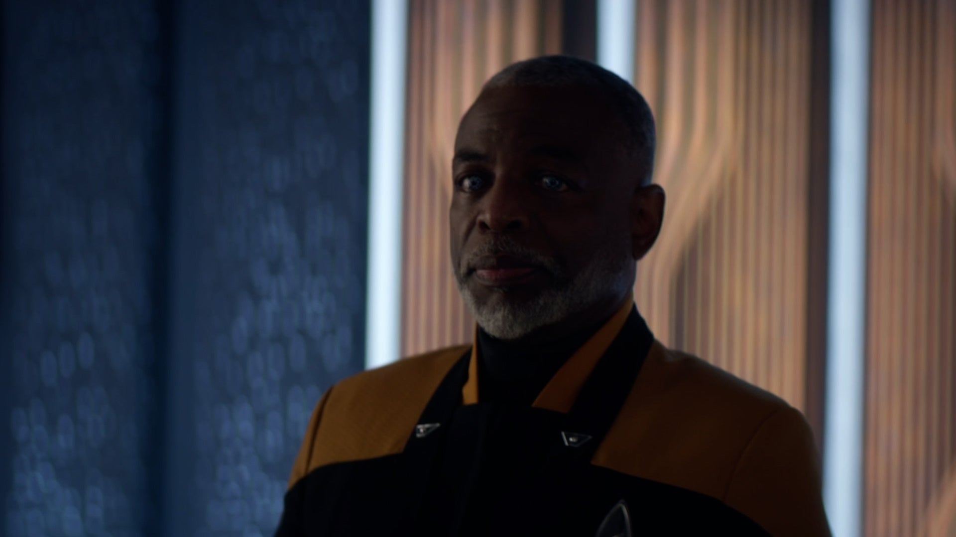 Commodore Geordi La Forge arrives on the Titan via transporter