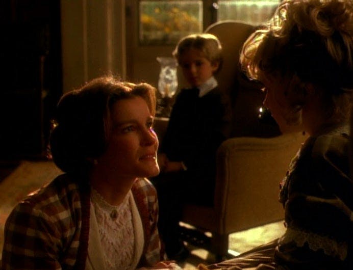 Janeway in a holo-novel tending to children as their governess in 'Learning Curve'