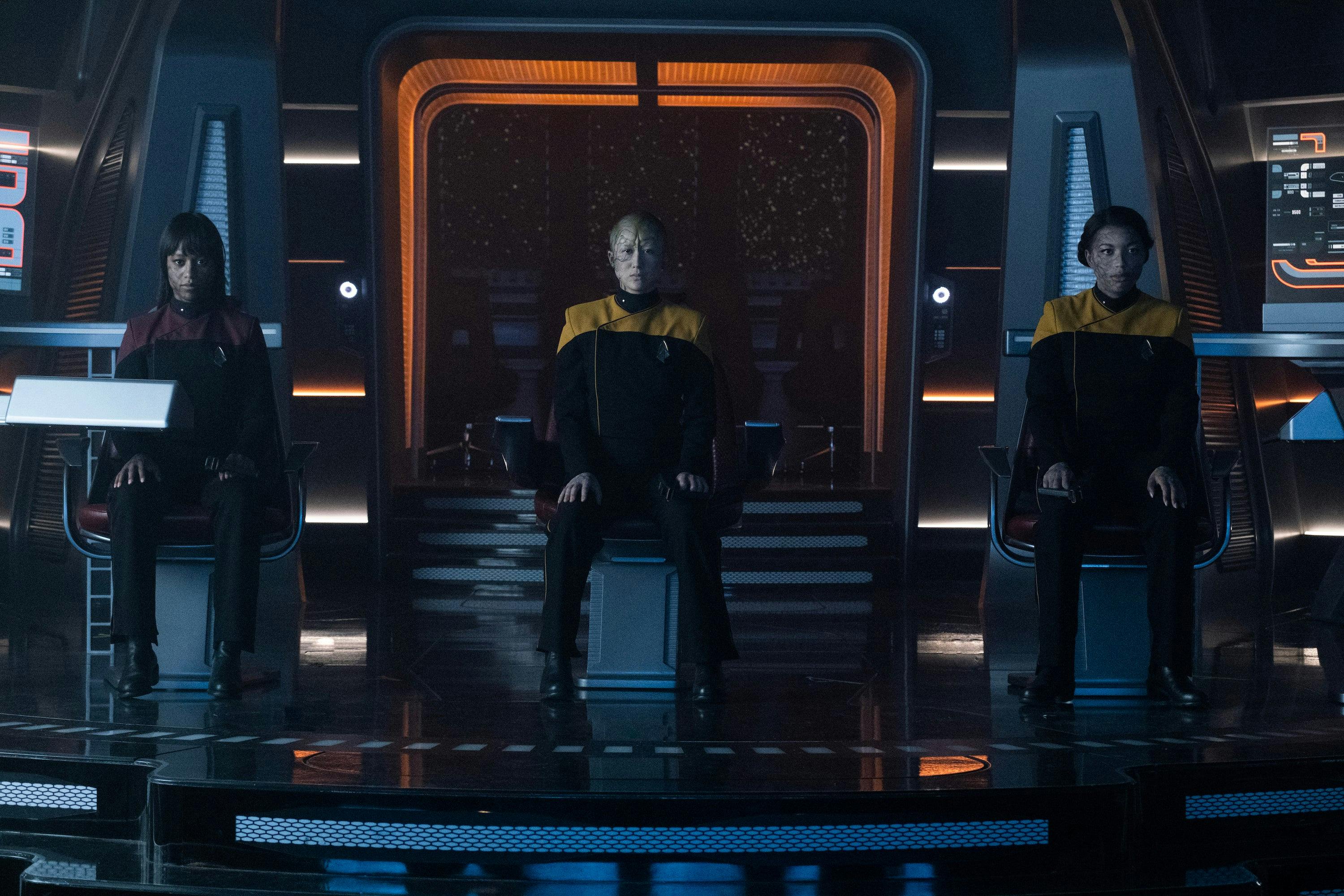 An assimilated Sidney La Forge, Esmar, and Alandra La Forge sit in command on the Bridge of the Titan in 'Vox'