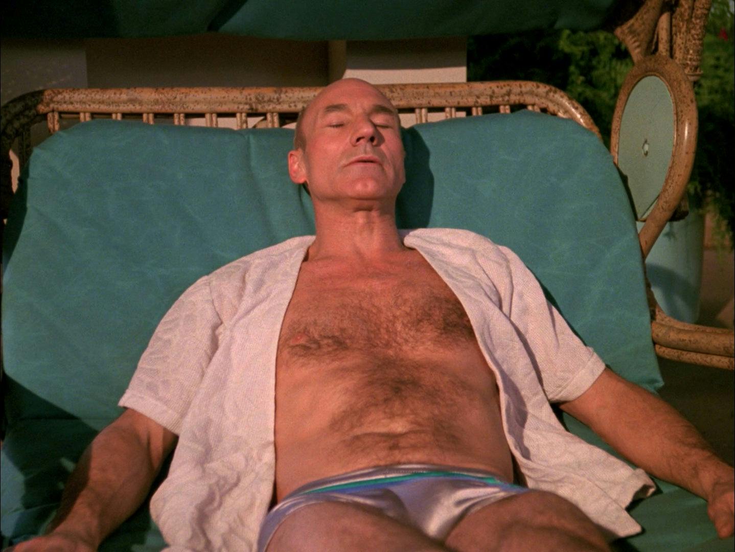 Picard lays out on a lounge chair taking in some sun and rest while on Risa in 'Captain's Holiday'