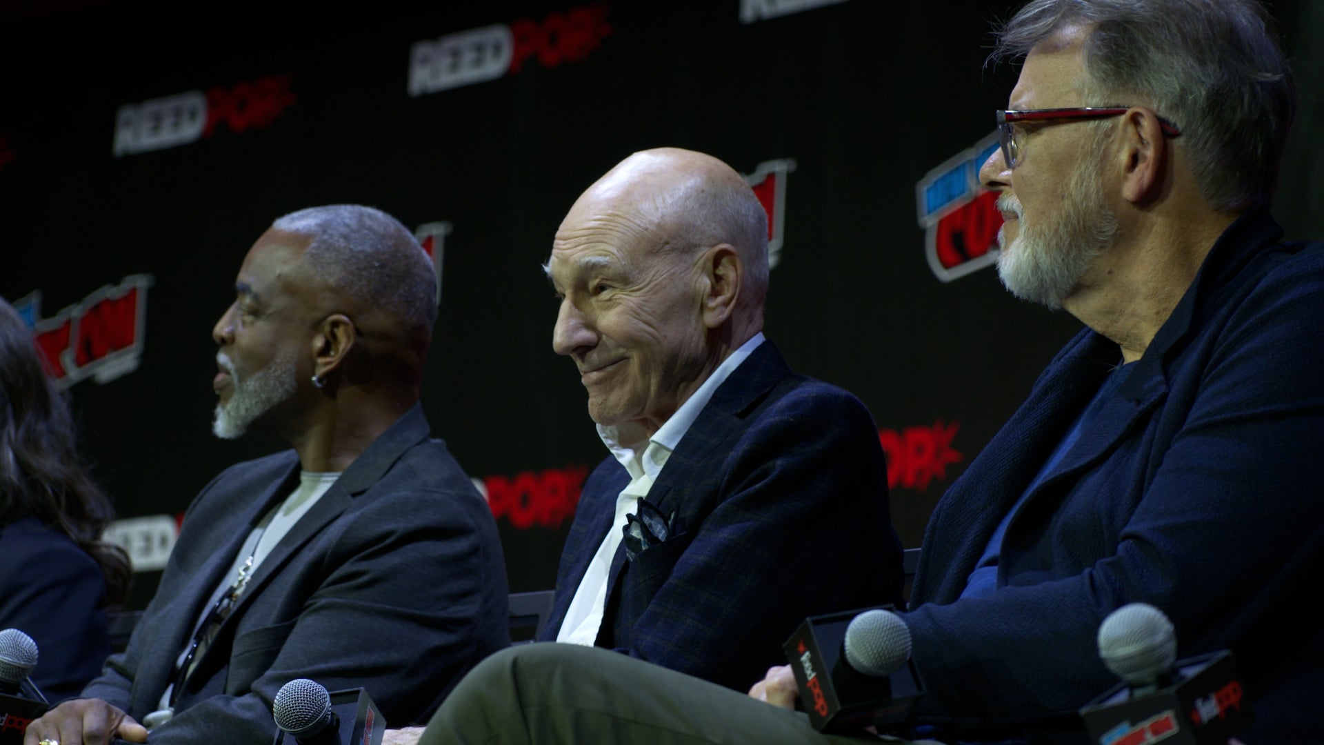 LeVar Burton, Sir Patrick Stewart, and Jonathan Frakes on stage at New York Comic Con 2022