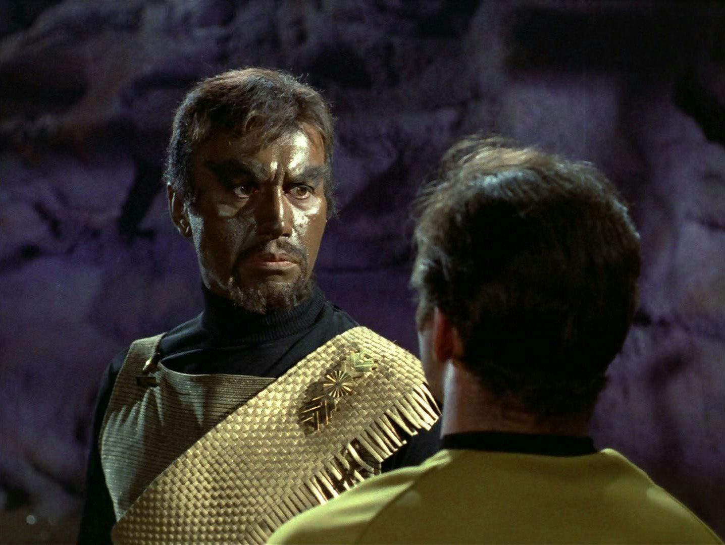 Close-up of Klingon Commander Kang as he looks directly at Captain Kirk in 'Day of the Dove'