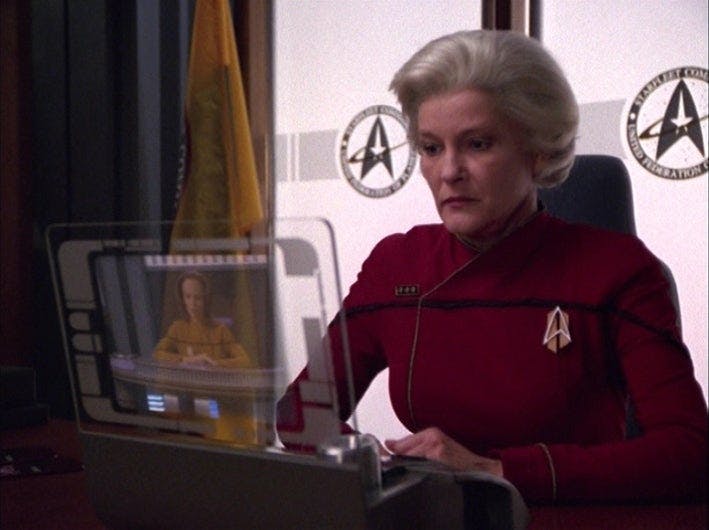 The future Admiral Janeway looks at her viewscreen monitor in 'Endgame'