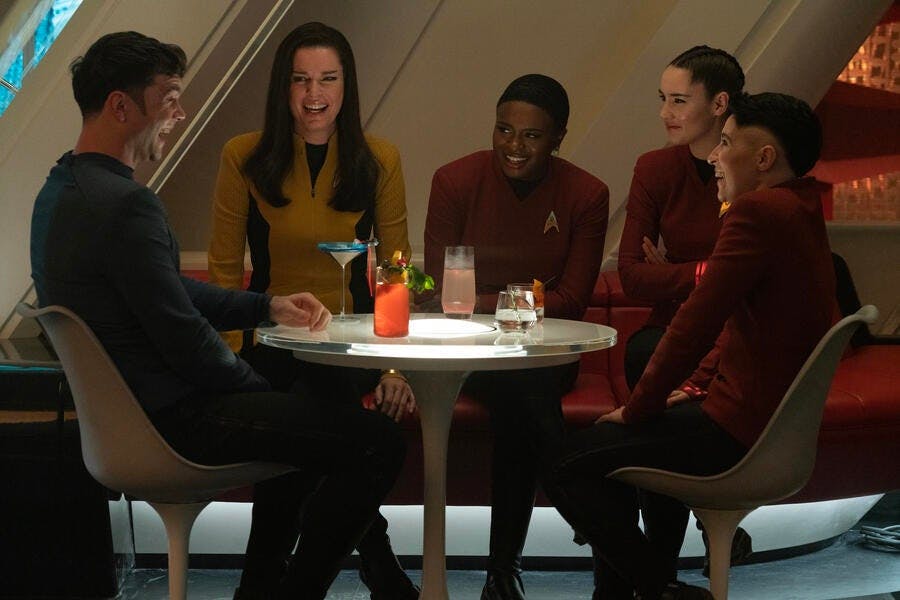 Spock expresses humor and laughter in the lounge while his friends Number One (Una), Uhura, La'An, and Erica Ortegas are slightly concerned in 'Charades'