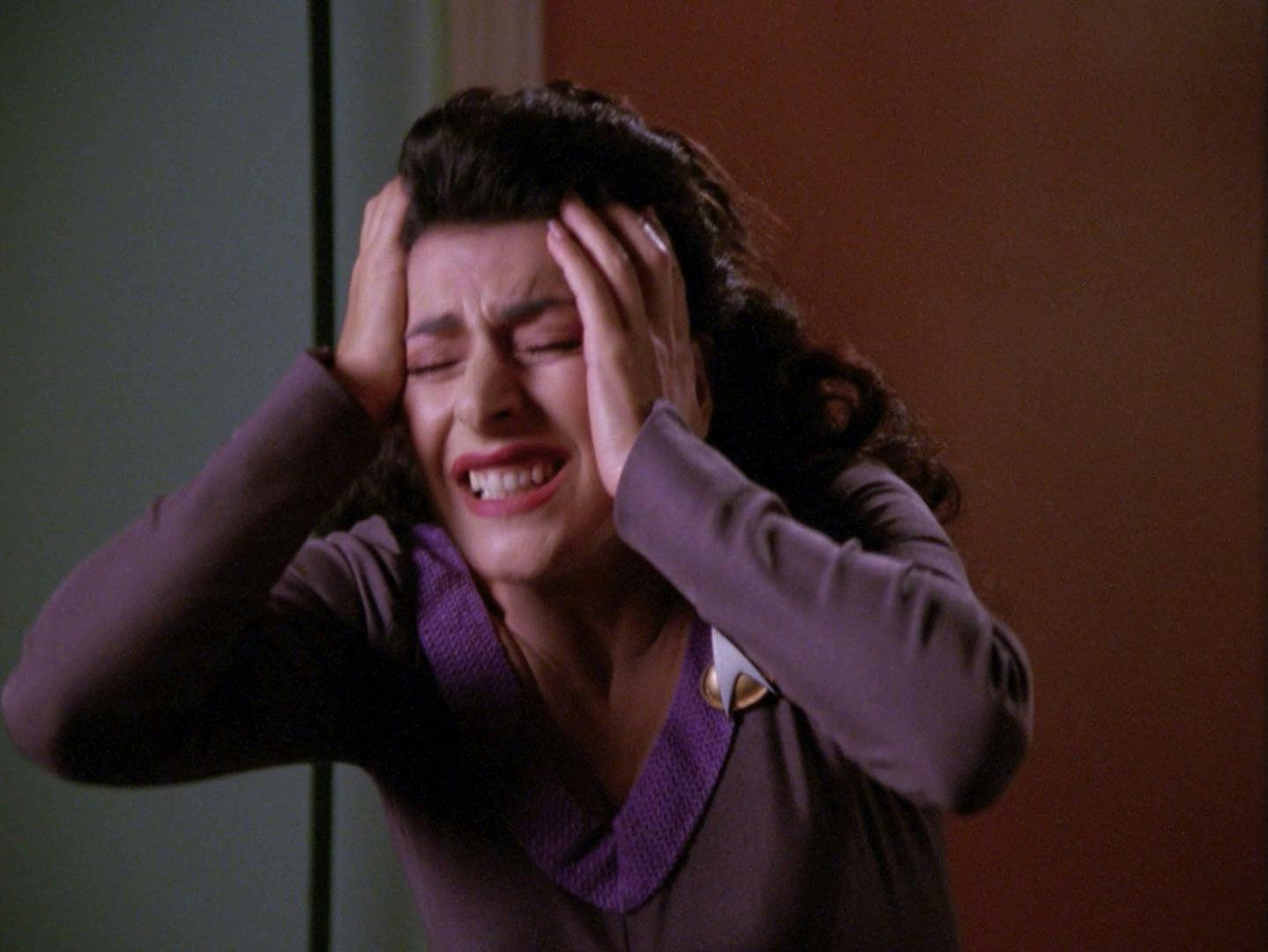 Deanna Troi reacts in pain and agony at the loss of her abilities