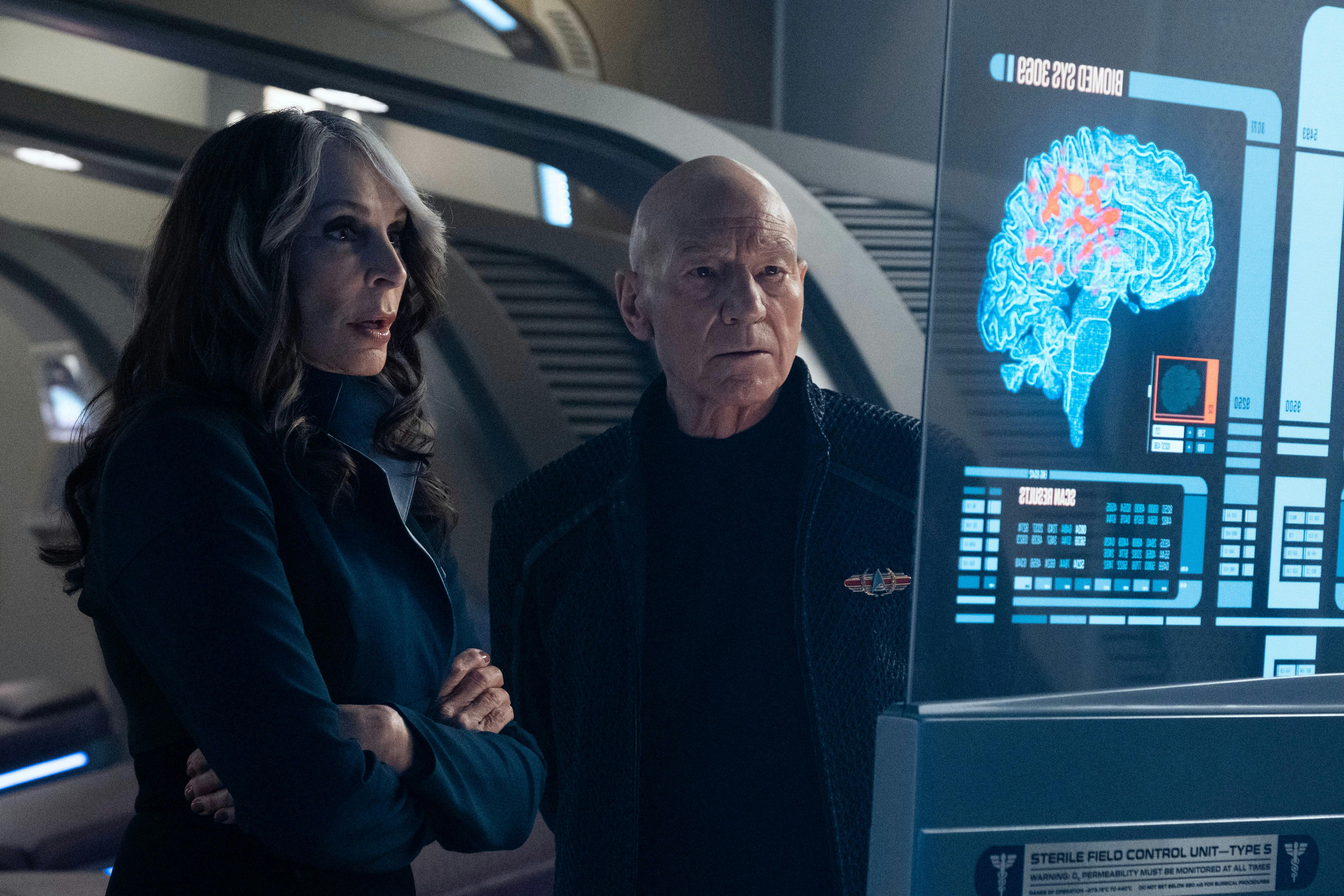 Beverly Crusher and Jean-Luc Picard looking a medical scan 