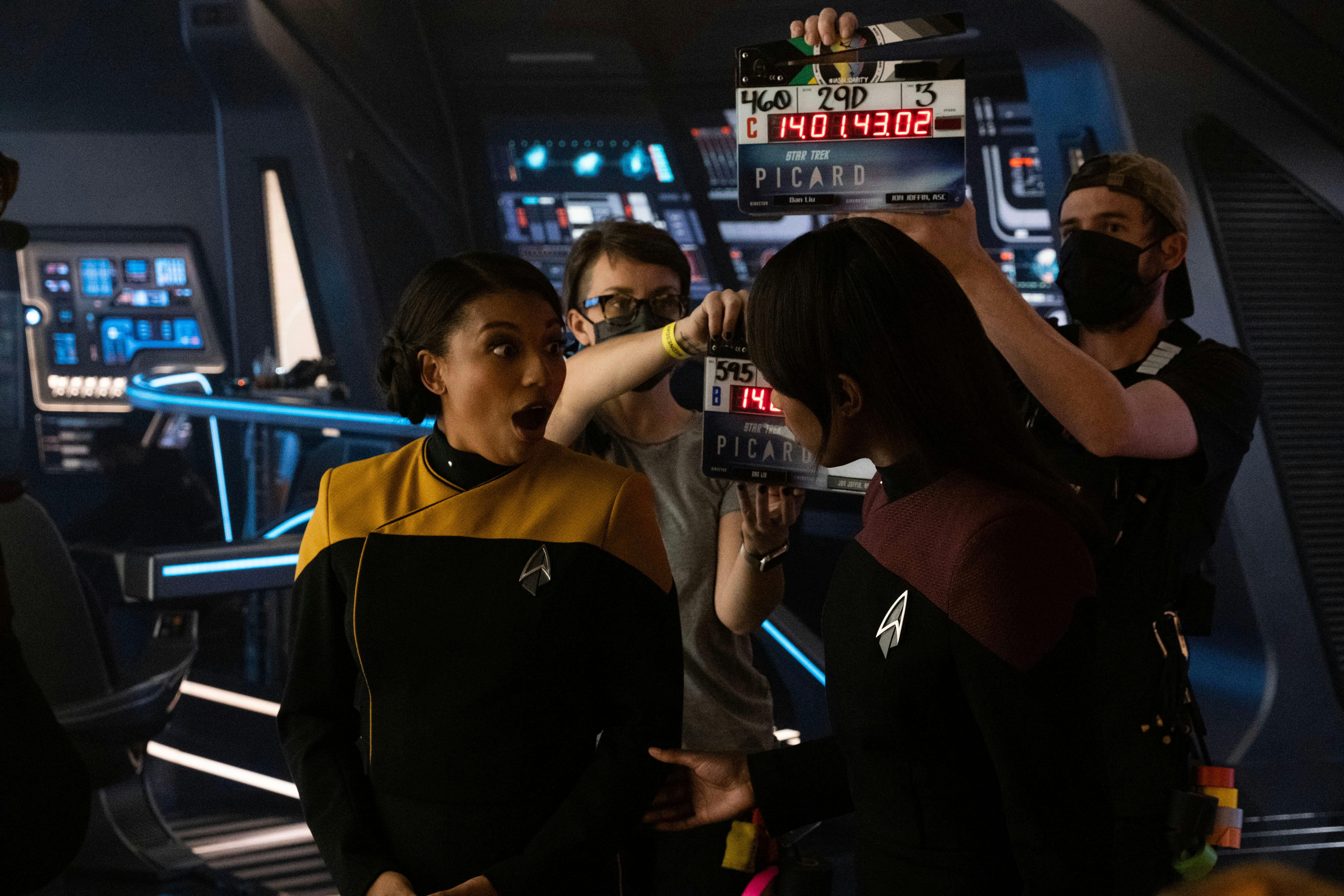 Behind-the-scenes still of Mica Burton reacting to Ashlei Sharpe Chestnut on the set of Star Trek: Picard