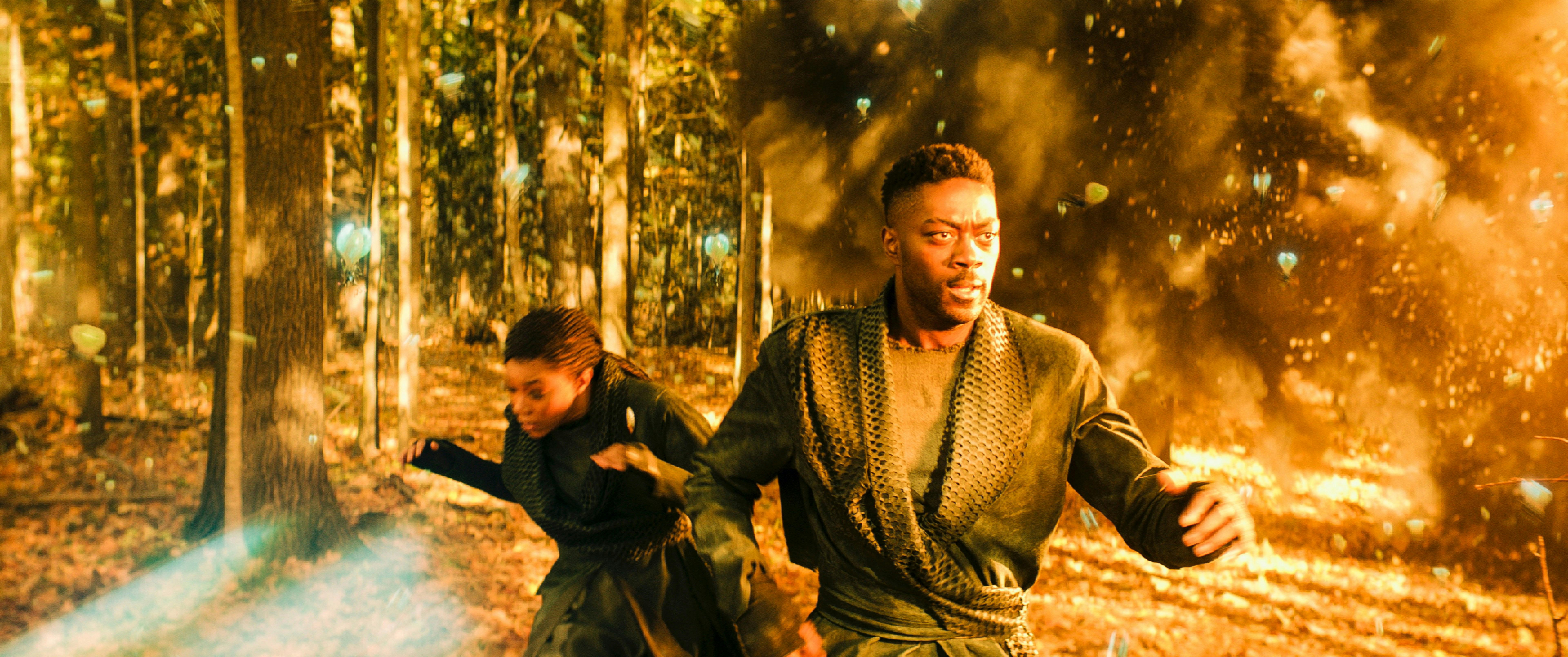 Michael Burnham and Cleveland 'Book' Booker flee the forested area of Kwejian as Osyraa has the Viridian open fire on the planet in 'The Sanctuary'