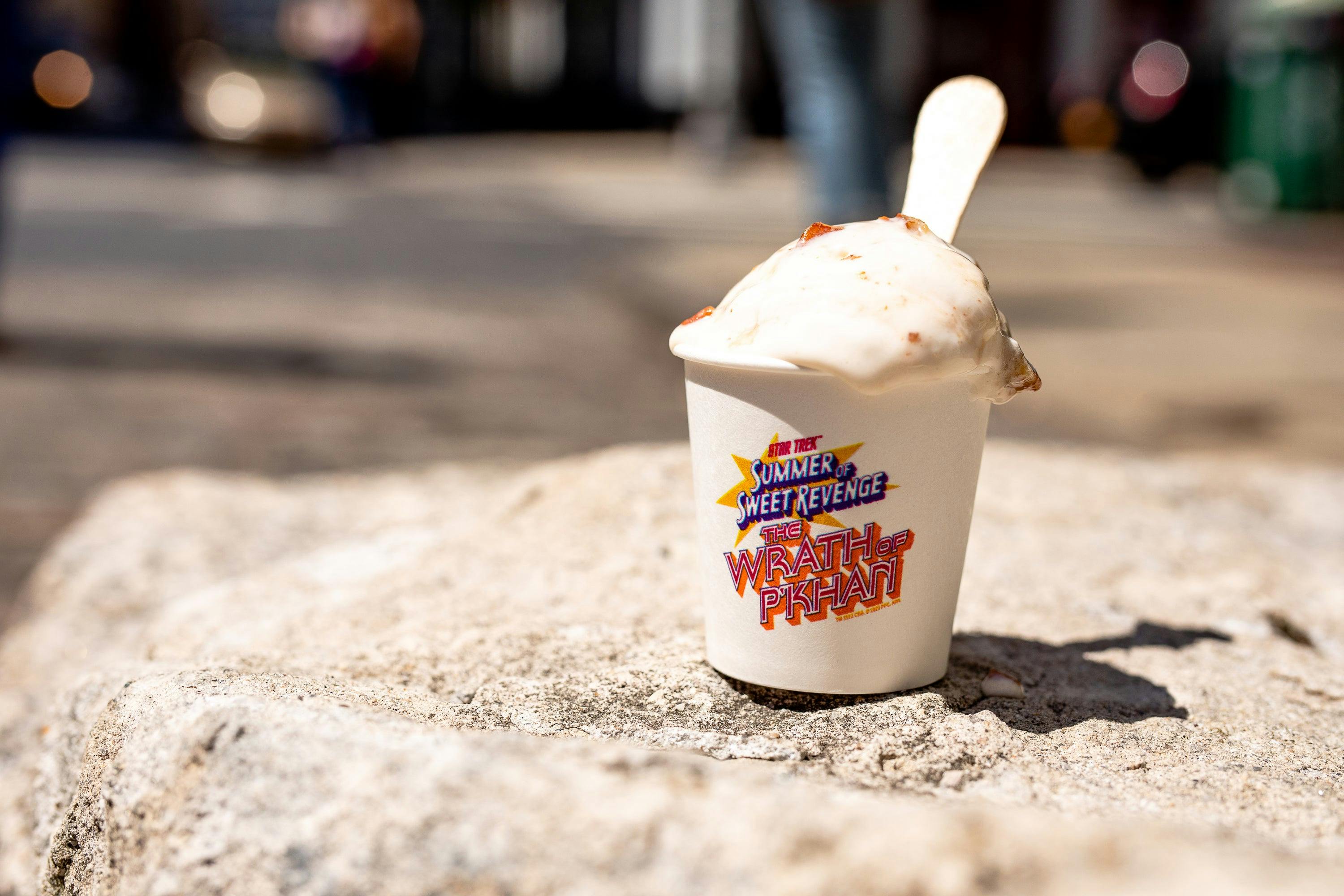 A melting cup of ice cream sits on a ledge. The flavor is the special Wrath of P'Khan flavor.