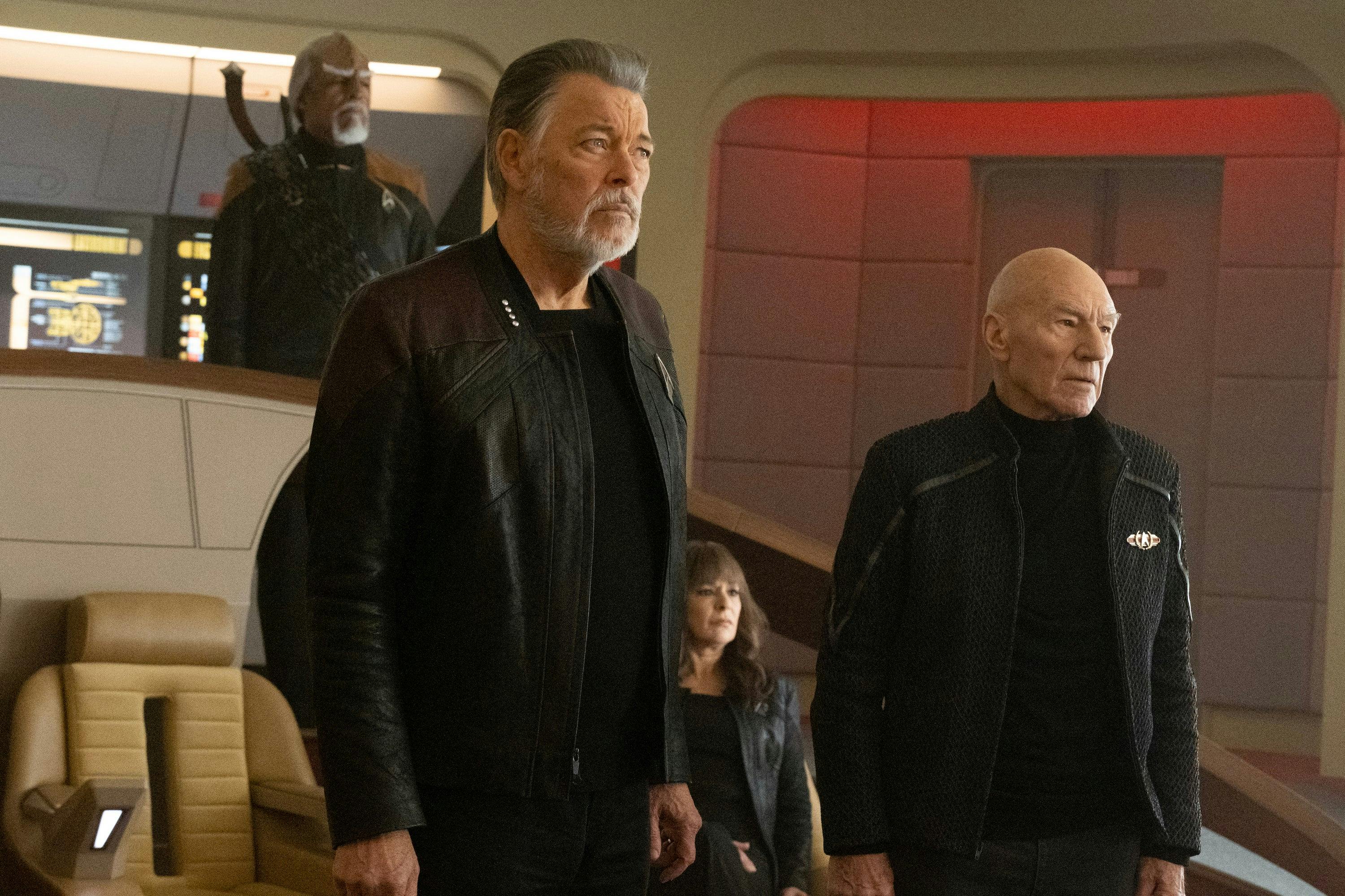 Will Riker and Jean-Luc Picard stand in front of their chairs in response to what they see on the viewscreen, with Deanna seated and Worf standing behind them in 'The Last Generation'