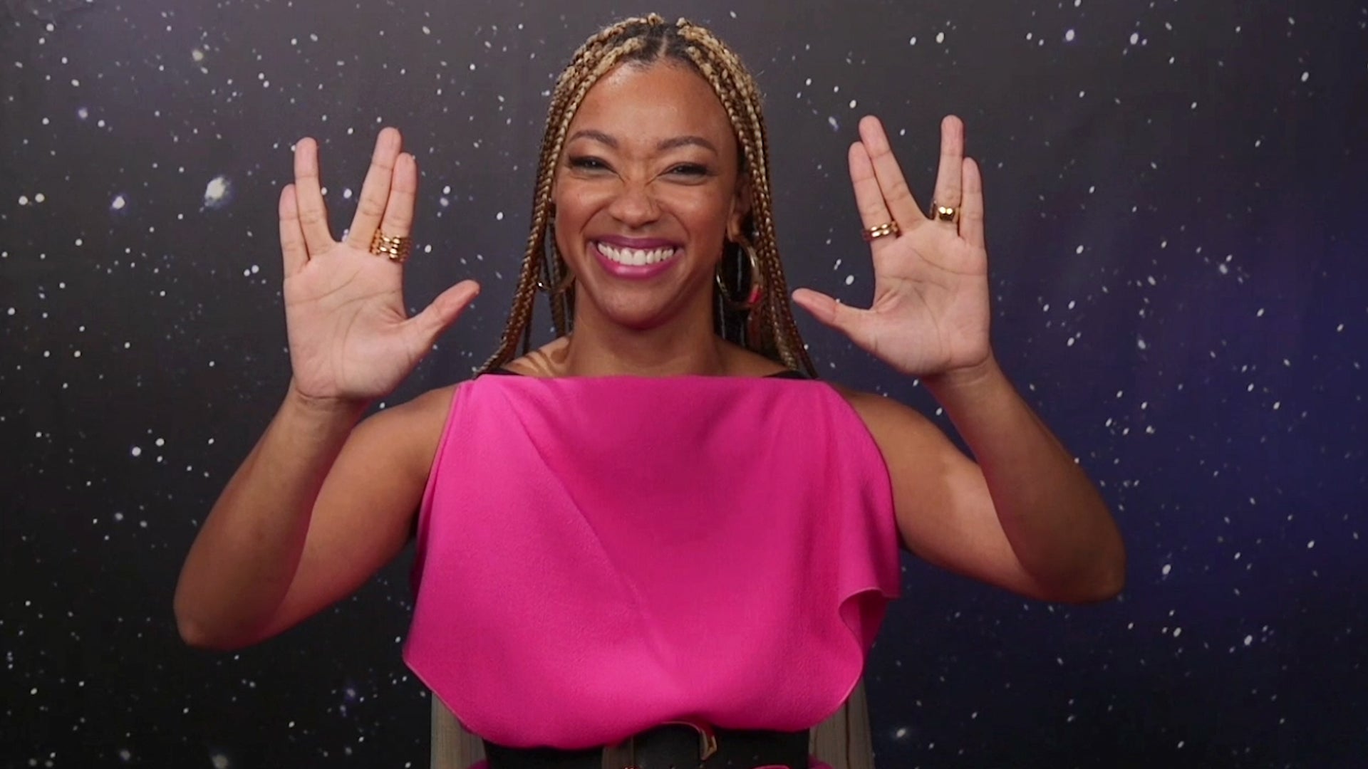 Sonequa Martin-Green gives two Vulcan salutes while answering fan questions at 2021's New York Comic Con.