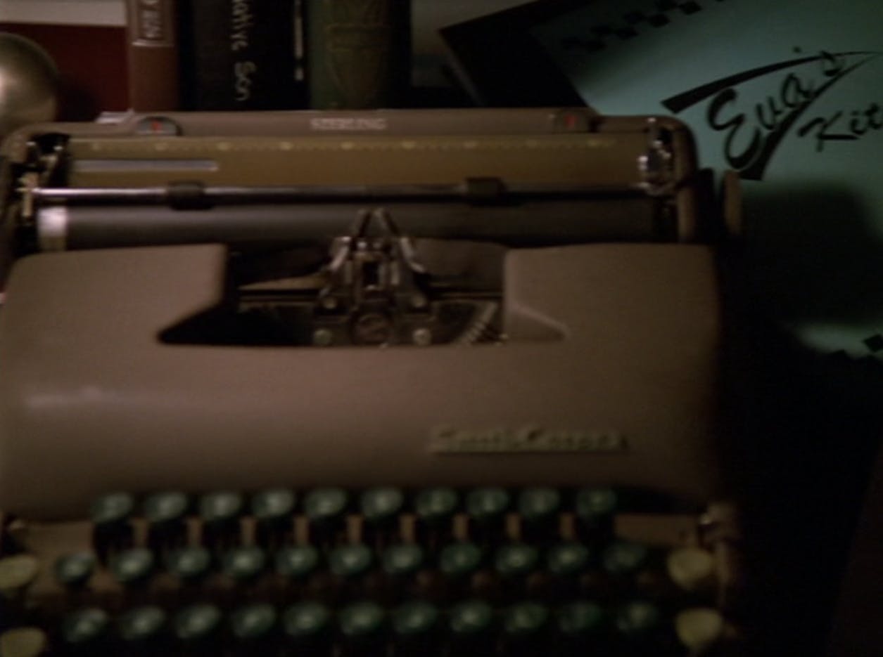 Close-up of Benny Russell's typewriter and his collection of books, which features the spine of Richard Wright's 'A Native Son' in 'Far Beyond the Stars'