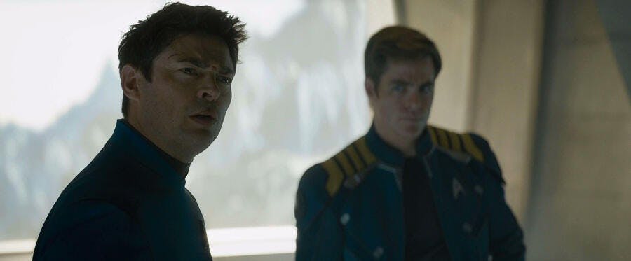 Leonard Bones McCoy throws an incredulous expression Spock's way as James T. Kirk looks over at his friend in Star Trek Beyond