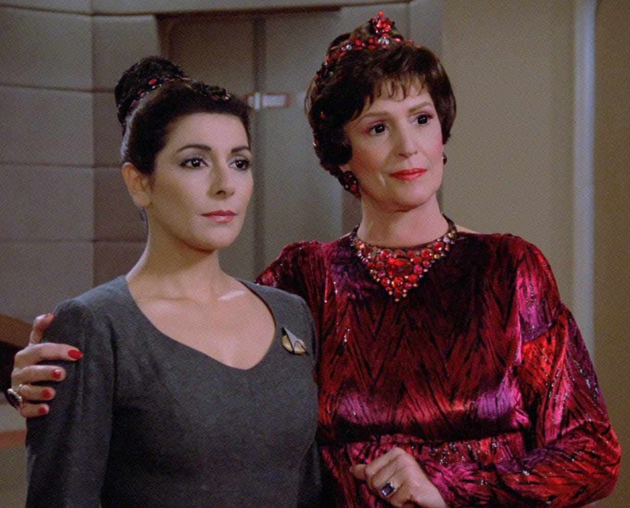 Lwaxana Troi wraps her arm around Deanna Troi's shoulders in 'Haven'