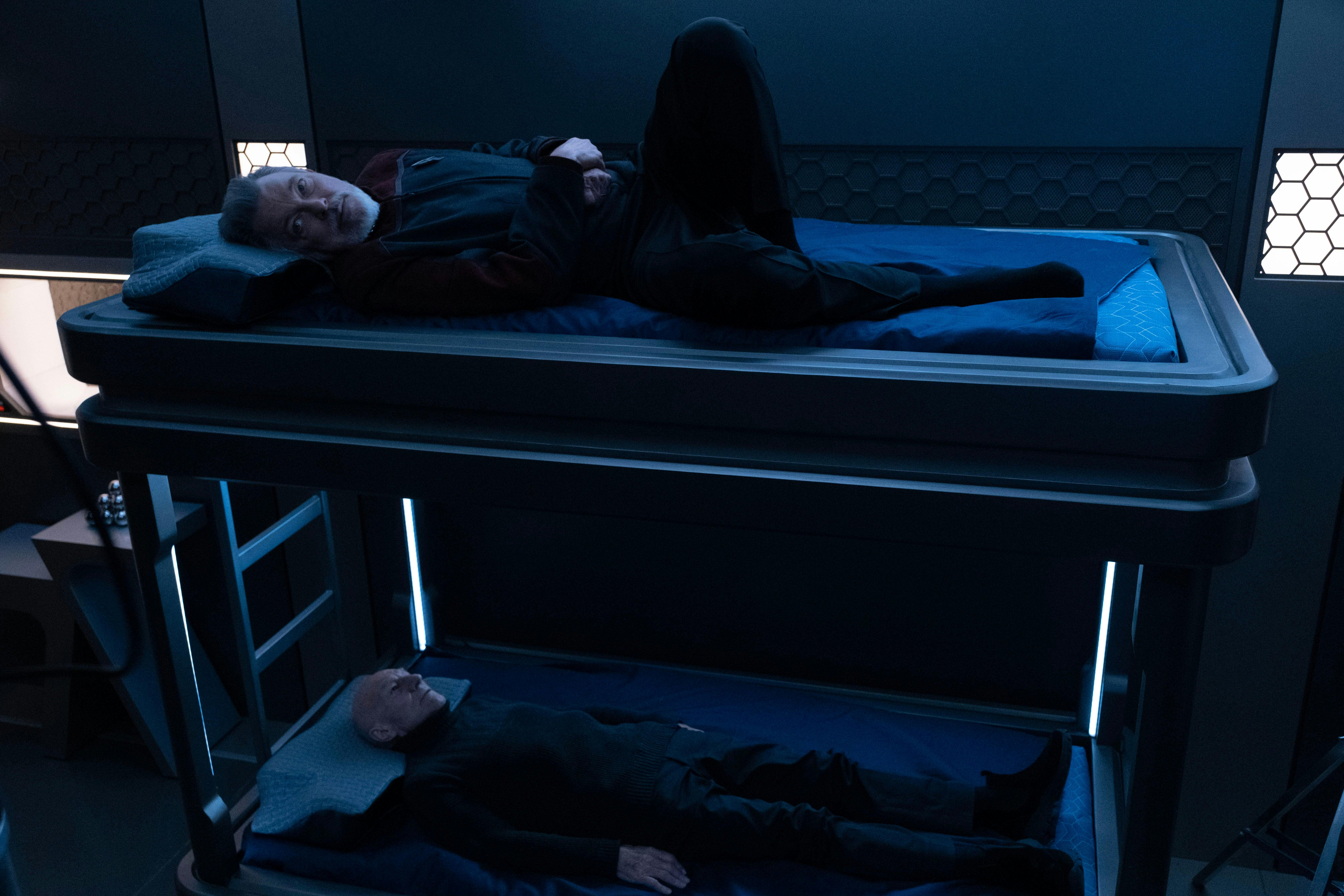 Shaw places Riker and Picard in bunk beds aboard the Titan