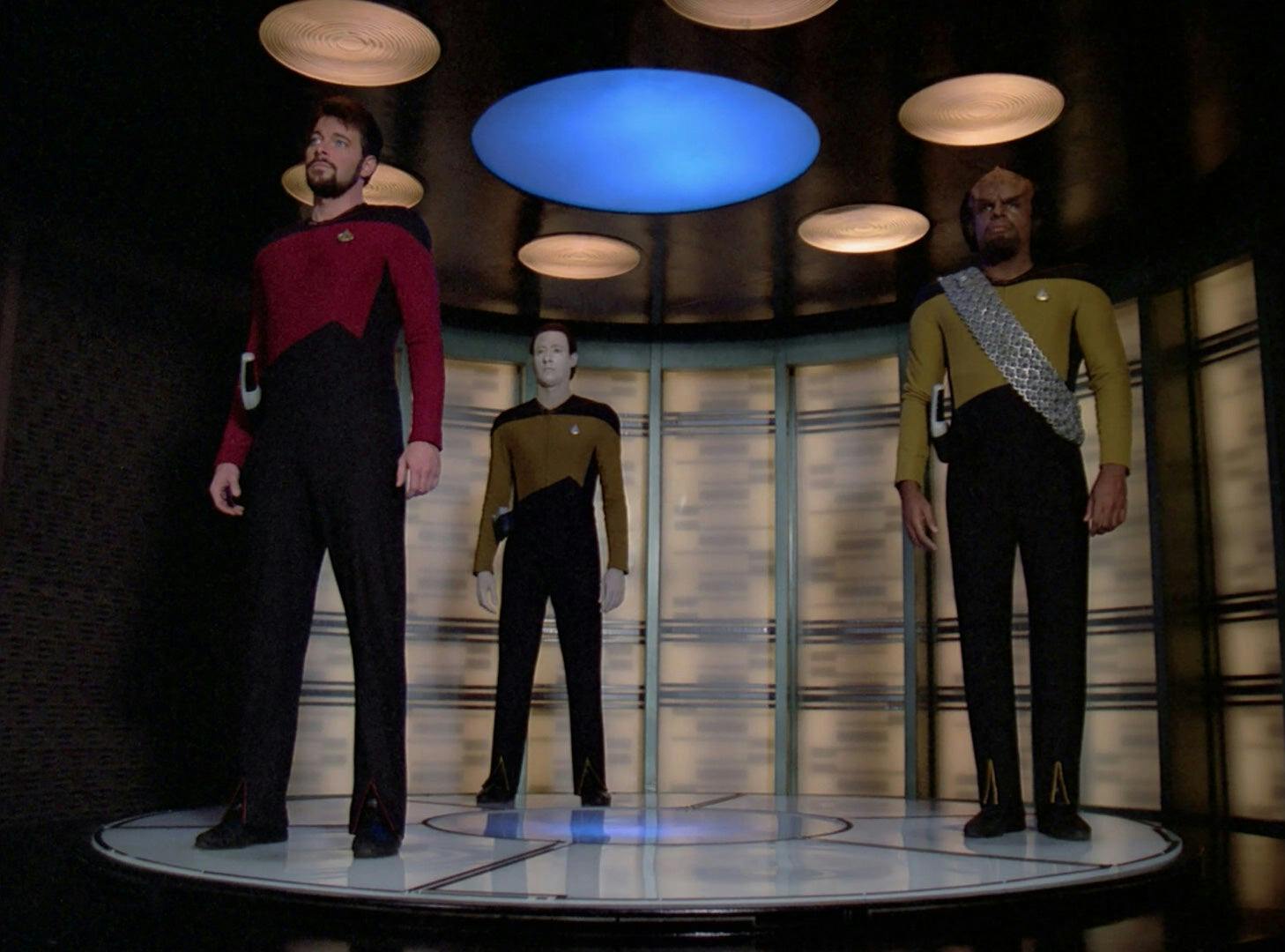 Riker, Data, and Worf get ready to beam down to a new planet.
