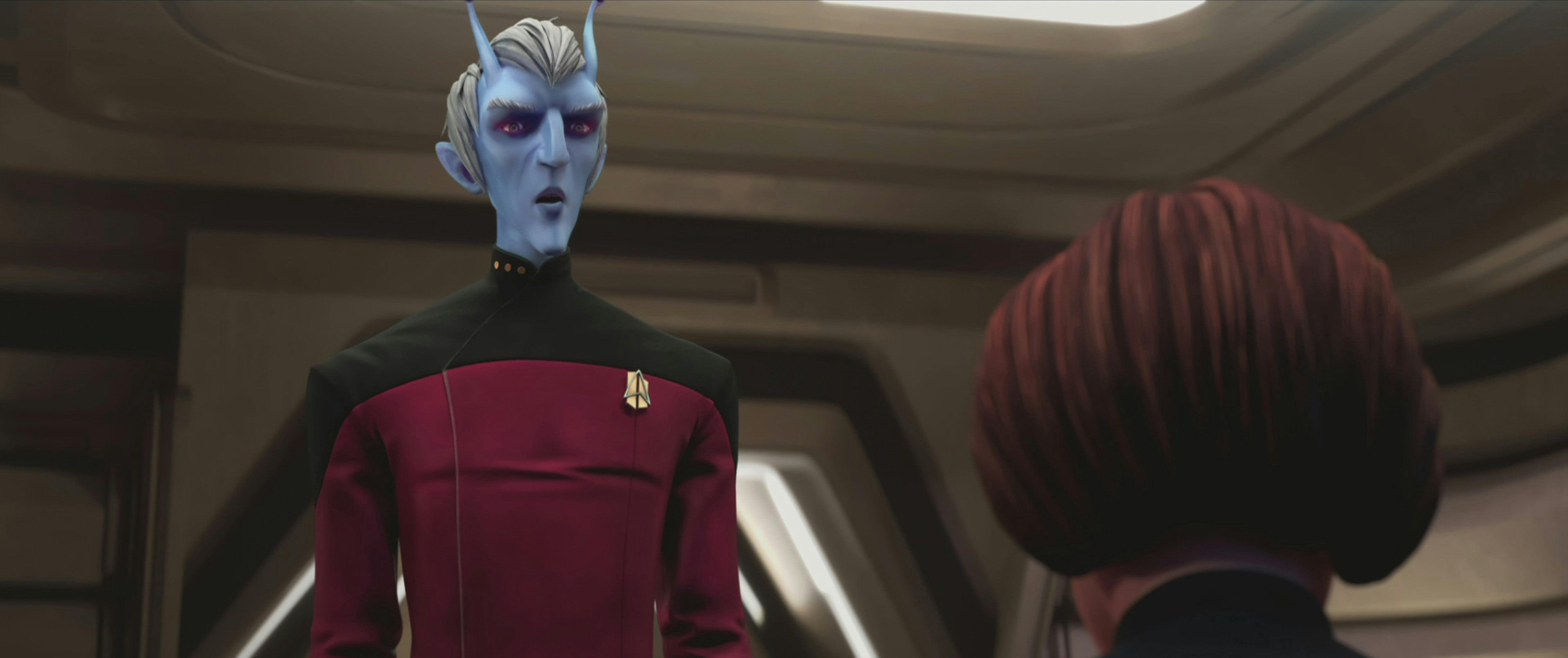Commander Tysess speaking to Janeway 