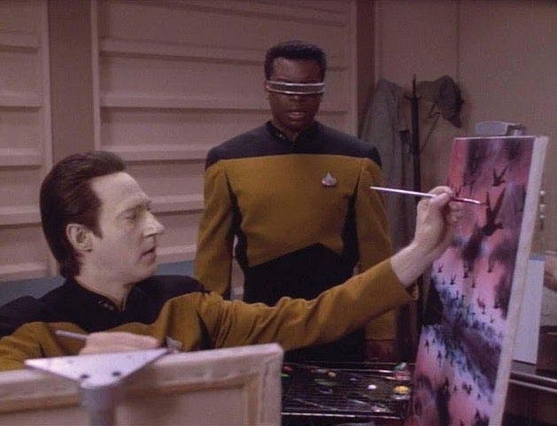 Geordi La Forge (LeVar Burton) checks in on his friend Data (Brent Spiner), who’s been pursuing an answer for his unexplained vision by deploying his creative skills