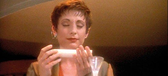 Kira Neys closes her eyes in meditation on Star Trek: Deep Space Nine