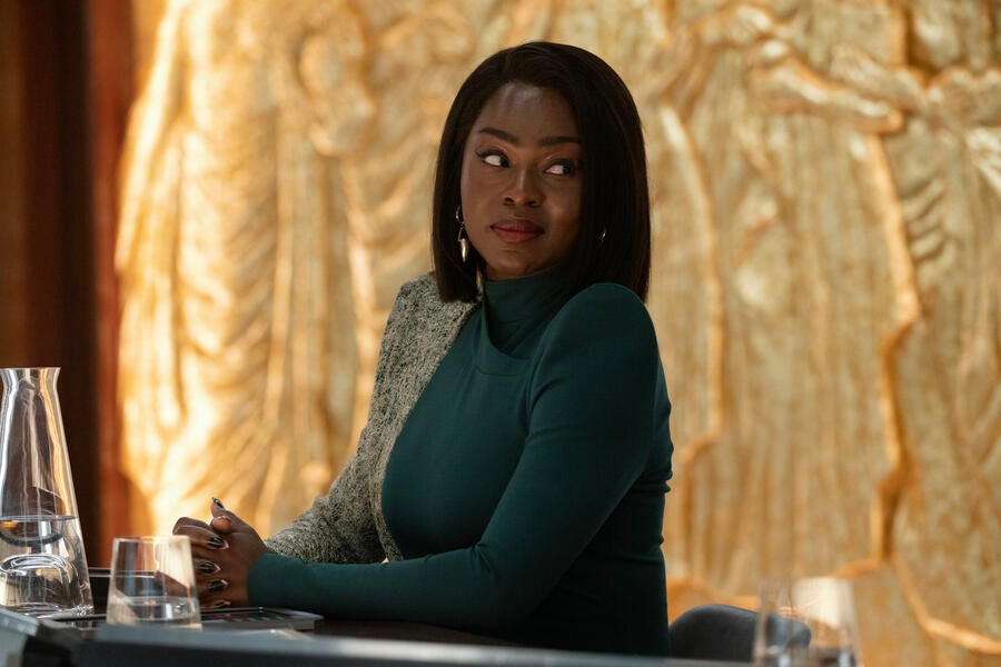 At Starfleet Headquarters' court room, sitting at the prosecutor's table, Neera Ketoul looks over her shoulder in 'Ad Astra per Aspera'