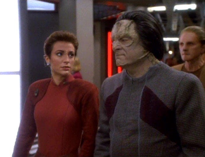 The Bajoran Kira Nerys walks alongside the Cardassian Marritza in 'Duet'