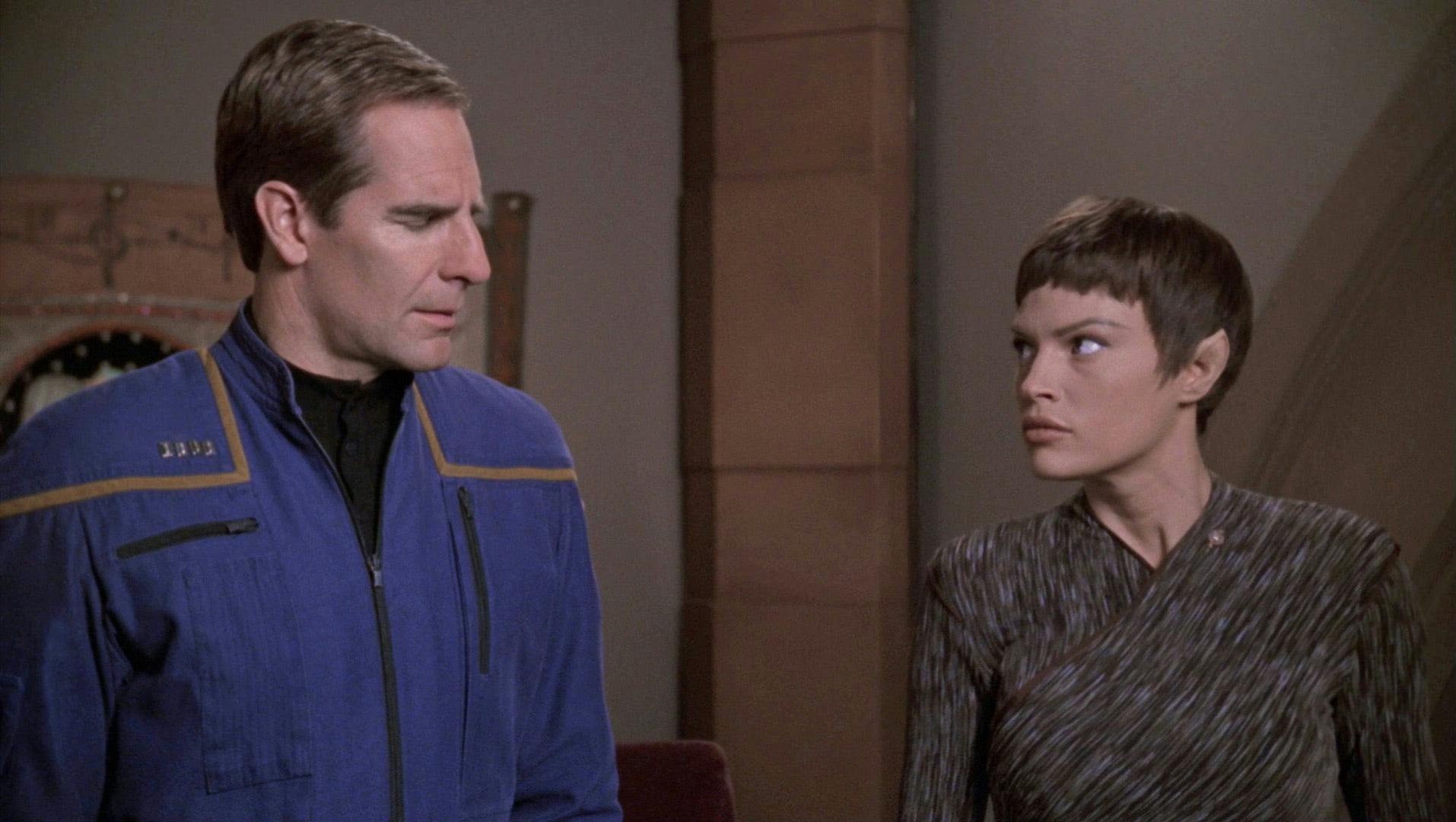 Archer closes his eyes as T'Pol looks up at him