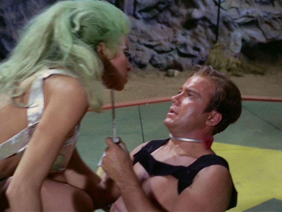Kirk holds a blade to an opponent's throat in 'The Gamesters of Triskelion'