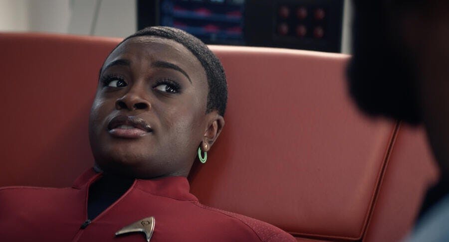 In Sickbay, Uhura lays in a med-bed and looks over to her left towards Dr. M'Benga in 'Lost in Translation'