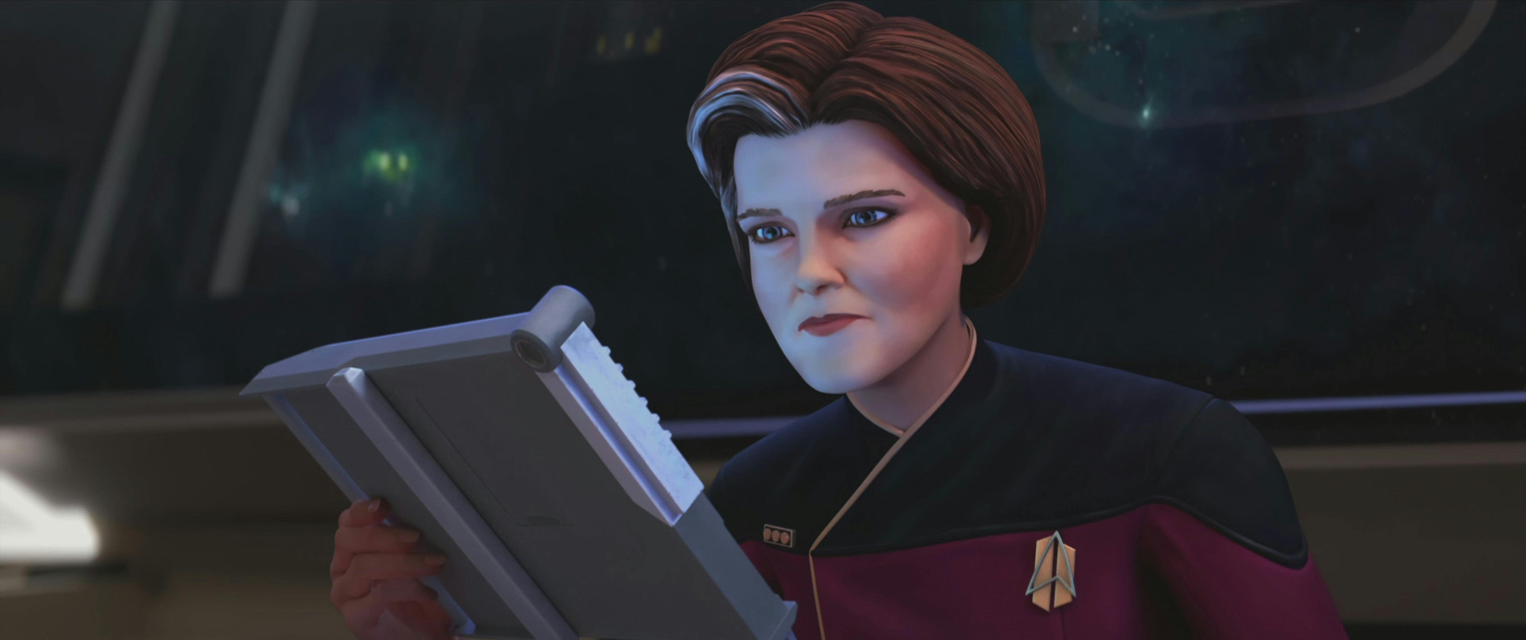 Janeway reading her PADD 