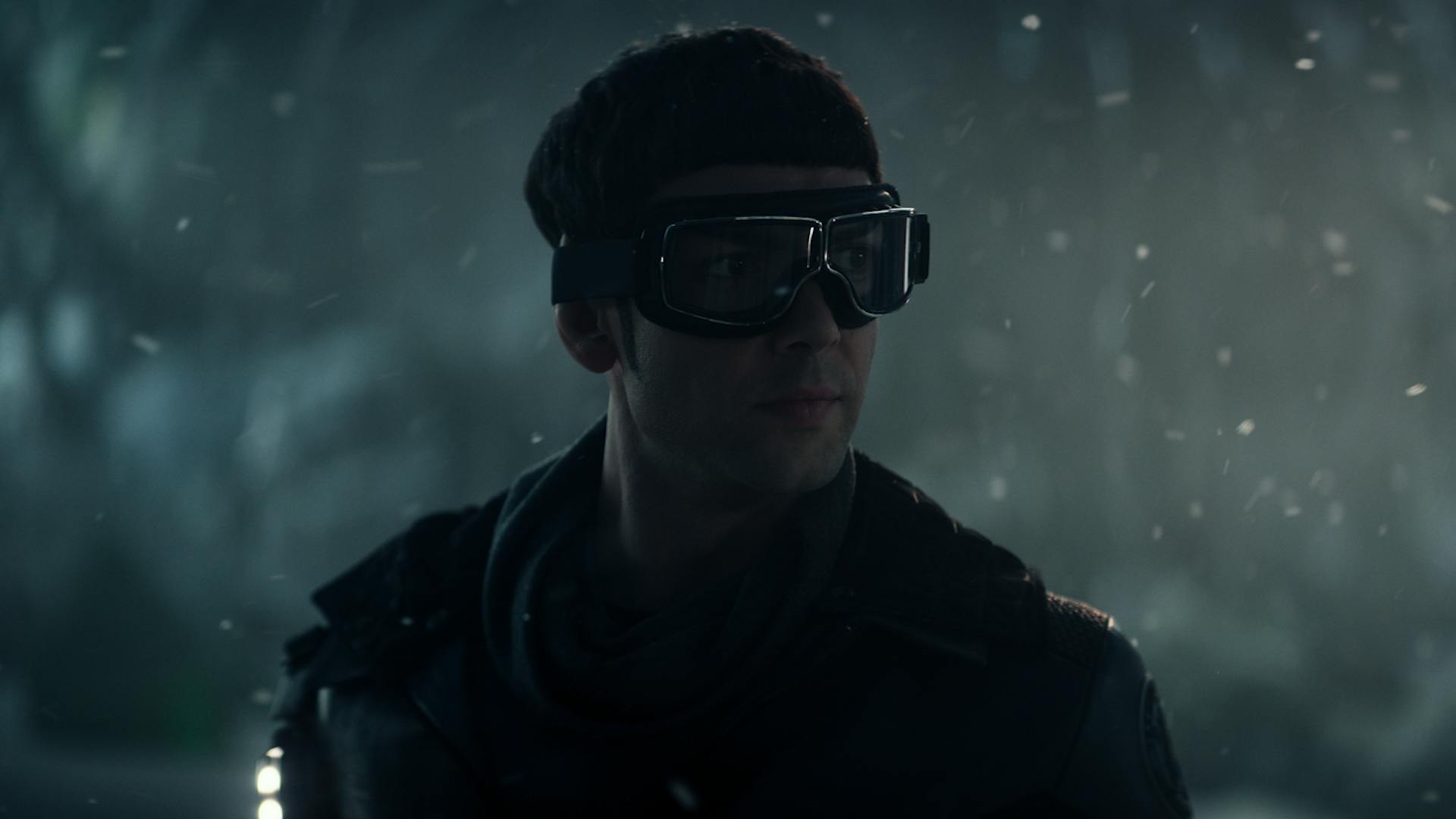 Spock (Ethan Peck), who is wearing goggles and a jacket, stands on an ice planet.