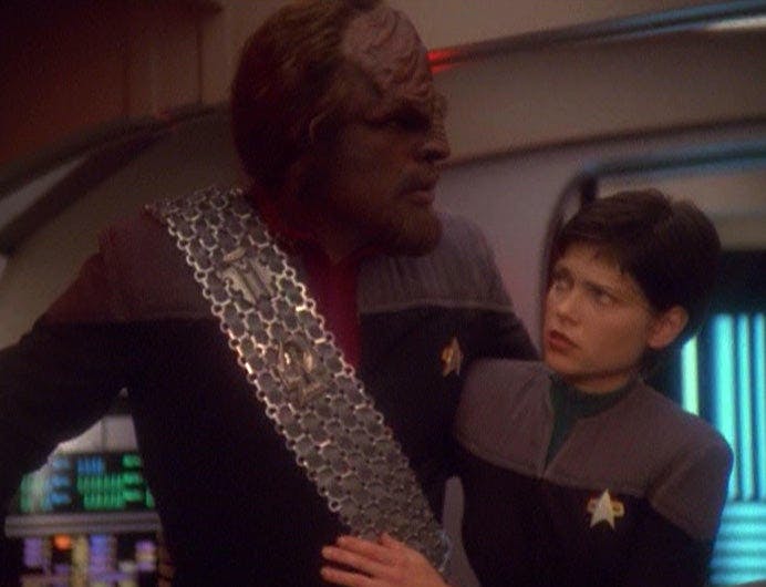 Ezri Dax aids a wounded Worf