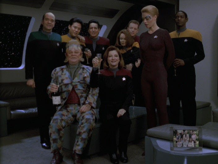 Star Trek: Voyager - '11:59' episodic still of the Voyager crew gathering and toasting