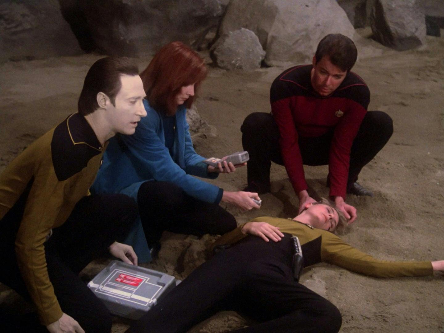 Data, Beverly Crusher, and Riker surround Tasha Yar's lifeless body in 'Skin of Evil'