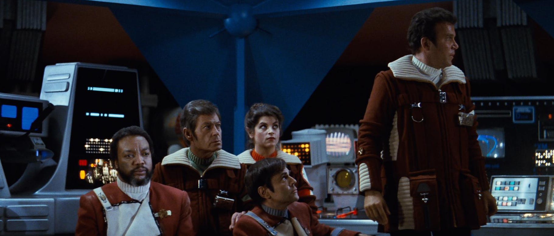 Kirk aboard Regula I surrounded by crew in Star Trek II: The Wrath of Khan