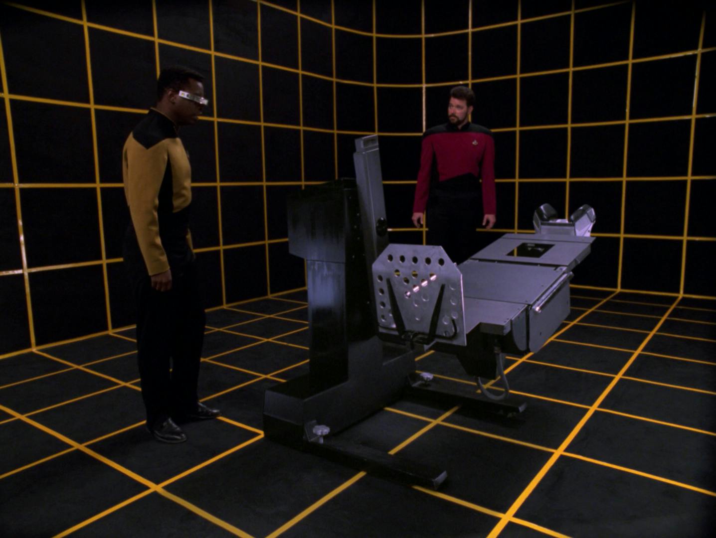 In the holodeck, Geordi La Forge and Will Riker reconstruct a medical examinational table in 'Schisms'