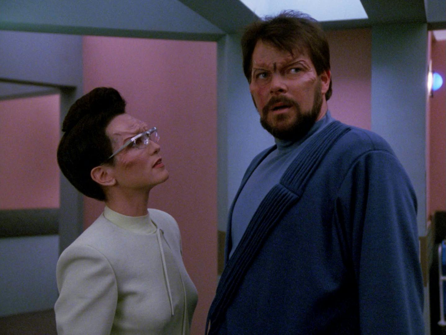 Despite his Malcorian disguise, Will Riker is exposed as an outsider at their hospital and pleads with a nurse to help him hide and flee in 'First Contact'