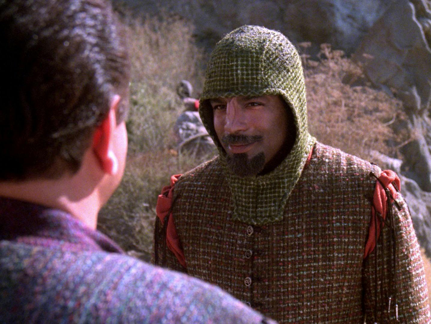 Worf, disguised as a Boraalan, converses with his foster brother Nikolai Rozenko on Boraal II in 'Homeward'